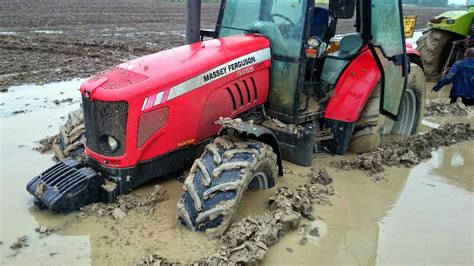 mini digger stuck in mud|farm tractors stuck in fields.